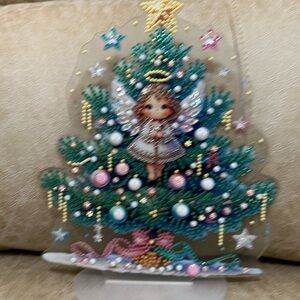 Holiday Angel Tree Decoration with Multicolor Accents.  In The Middle